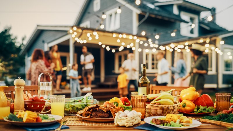 A backyard table filled with summer foods to enjoy with dental implants