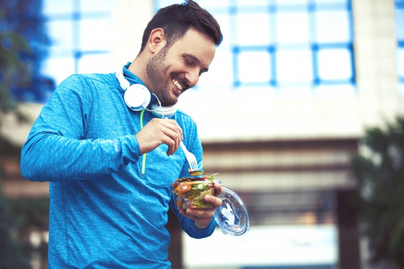 Patient smiling after exercise while eating